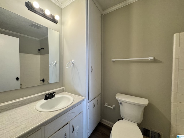 full bath featuring visible vents, toilet, ornamental molding, vanity, and walk in shower