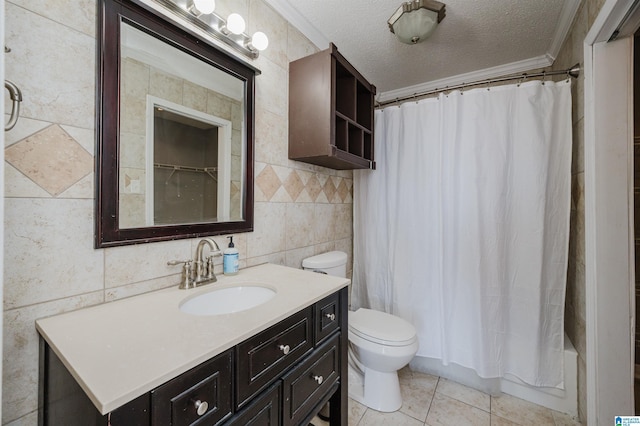 bathroom with a textured ceiling, toilet, vanity, tile walls, and shower / tub combo with curtain