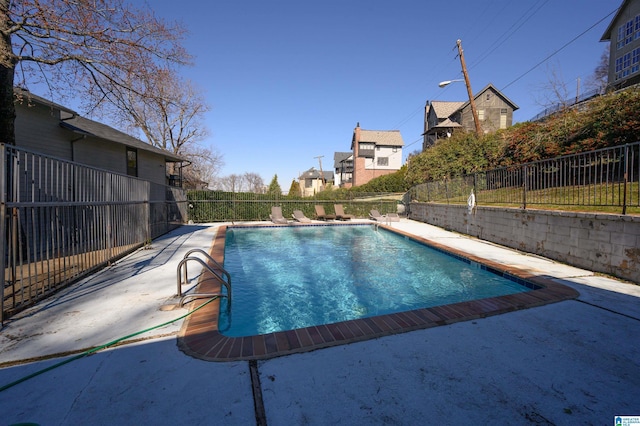 view of swimming pool with fence and a fenced in pool