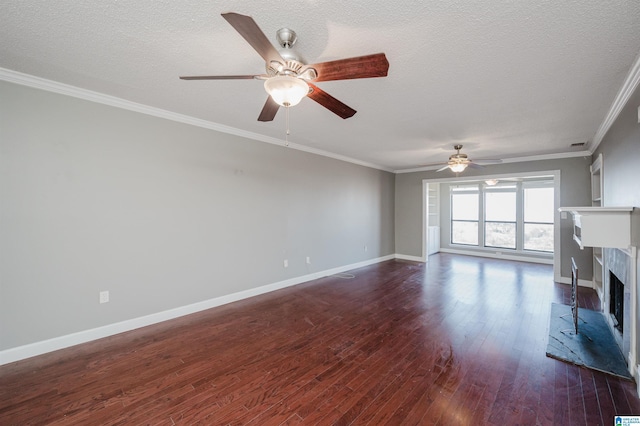 unfurnished living room featuring dark wood-type flooring, ornamental molding, baseboards, and a premium fireplace