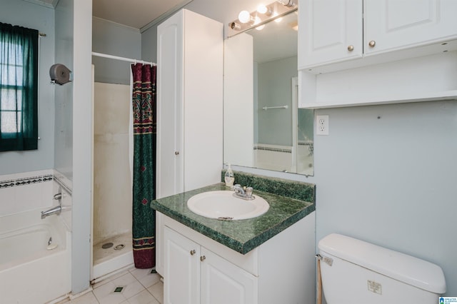 bathroom with toilet, vanity, a shower stall, a bath, and tile patterned floors