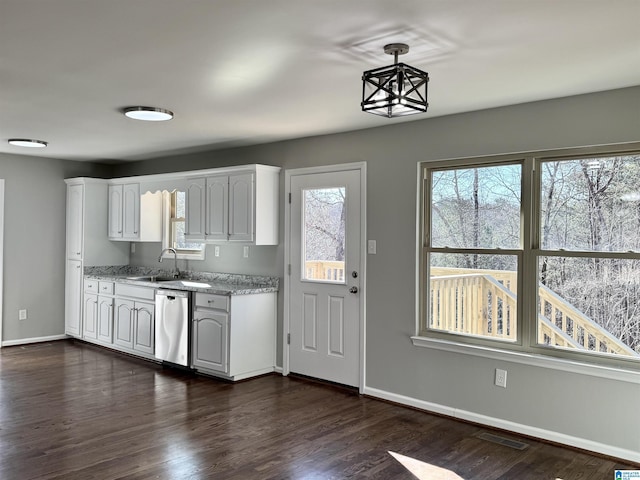 kitchen with visible vents, pendant lighting, white cabinets, and dishwasher