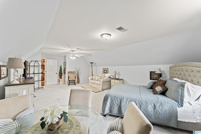 bedroom featuring light colored carpet, visible vents, a ceiling fan, vaulted ceiling, and baseboards