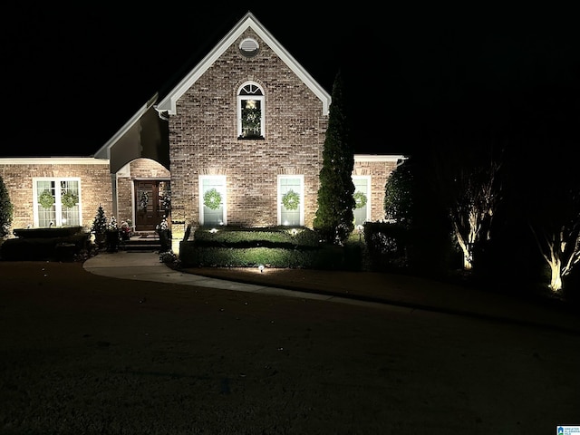 traditional-style home featuring brick siding