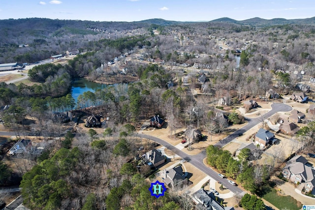 birds eye view of property featuring a residential view and a water and mountain view