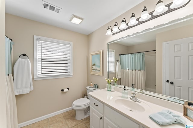 bathroom featuring visible vents, toilet, vanity, tile patterned flooring, and baseboards