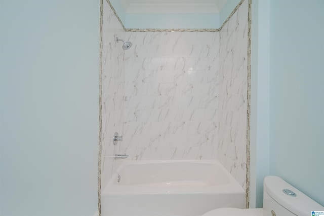 bathroom featuring bathtub / shower combination and toilet