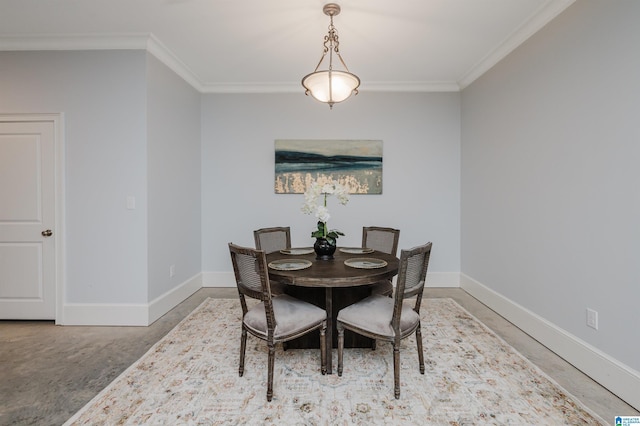 dining space featuring ornamental molding and baseboards