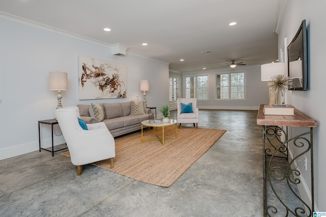 living area with concrete flooring, ceiling fan, recessed lighting, baseboards, and crown molding