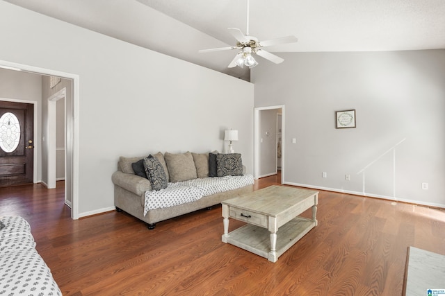 living area with a ceiling fan, dark wood finished floors, high vaulted ceiling, and baseboards