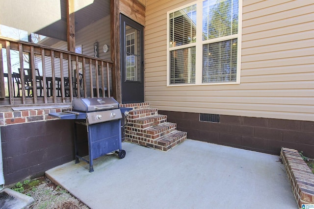 view of patio featuring a grill