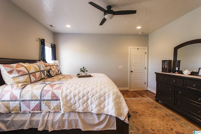 bedroom with recessed lighting, visible vents, a ceiling fan, wood finished floors, and baseboards