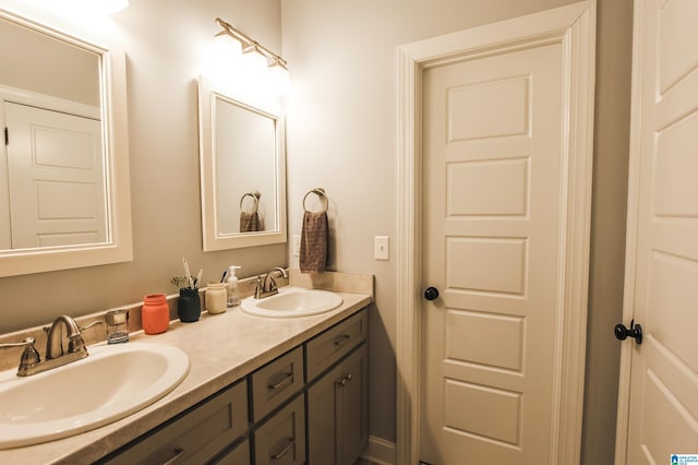 bathroom with double vanity and a sink