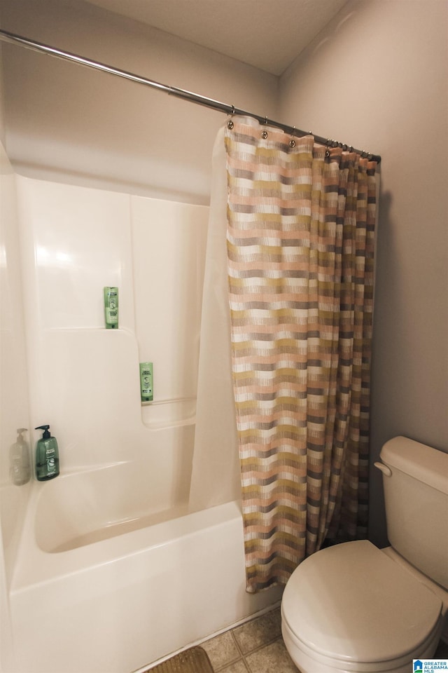 bathroom featuring shower / tub combo, toilet, and tile patterned floors