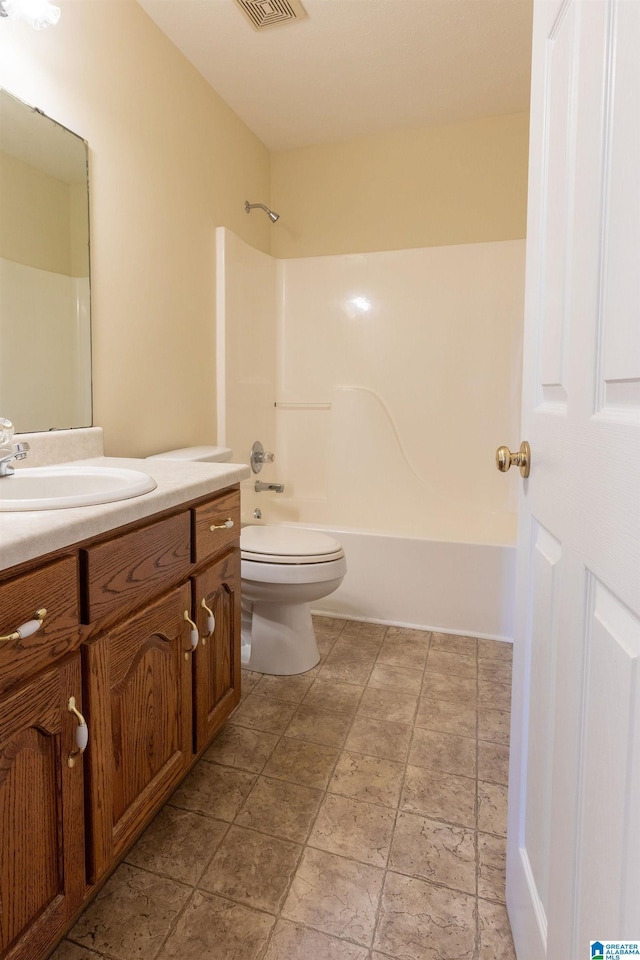 bathroom featuring toilet, visible vents,  shower combination, and vanity