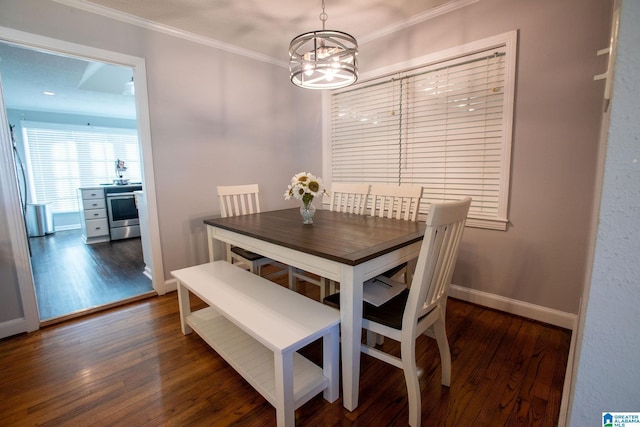 dining room featuring baseboards, ornamental molding, a chandelier, and dark wood-type flooring