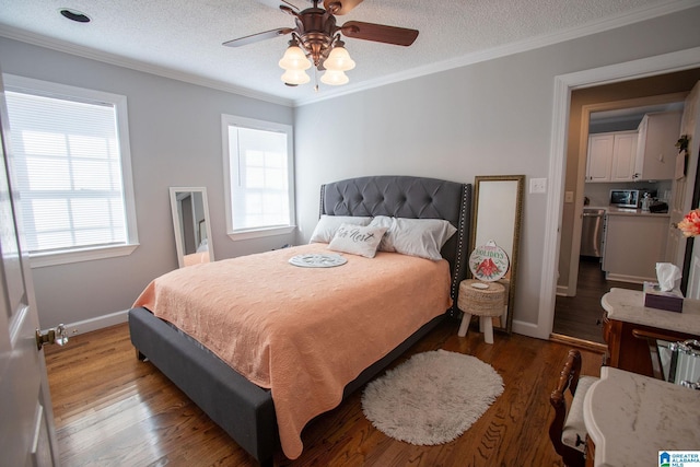 bedroom featuring crown molding, baseboards, and wood finished floors