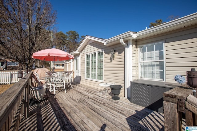 wooden deck with outdoor dining area