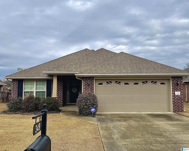 ranch-style home with a shingled roof, brick siding, driveway, and a garage