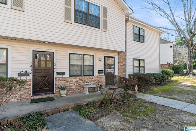 view of front of home with brick siding