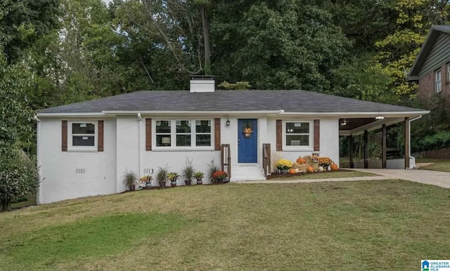 ranch-style home with concrete driveway, a chimney, crawl space, a front lawn, and brick siding