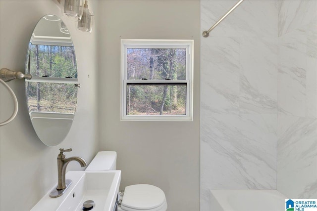 full bathroom with a sink and toilet