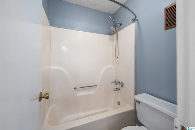 full bathroom with toilet, a textured ceiling, shower / bath combination, and visible vents