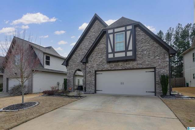 view of front of home featuring concrete driveway, brick siding, an attached garage, and central air condition unit