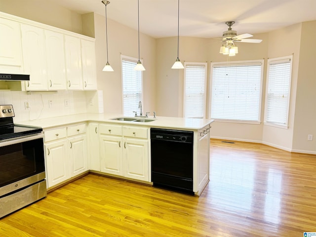 kitchen featuring dishwasher, a peninsula, stainless steel range with electric cooktop, light wood-type flooring, and a sink