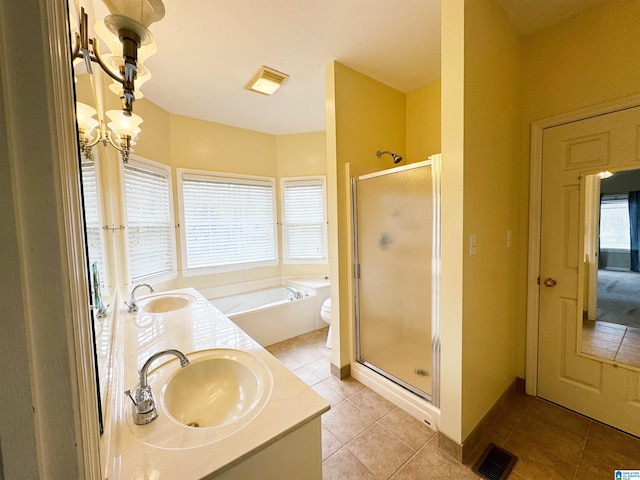 full bathroom with a shower stall, a sink, visible vents, and tile patterned floors