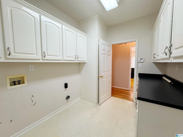 laundry room featuring cabinet space, baseboards, hookup for an electric dryer, light floors, and washer hookup