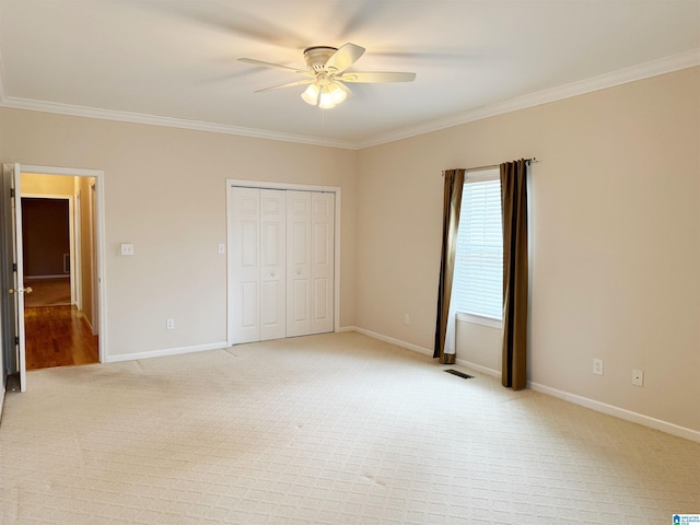 unfurnished bedroom featuring ornamental molding and baseboards