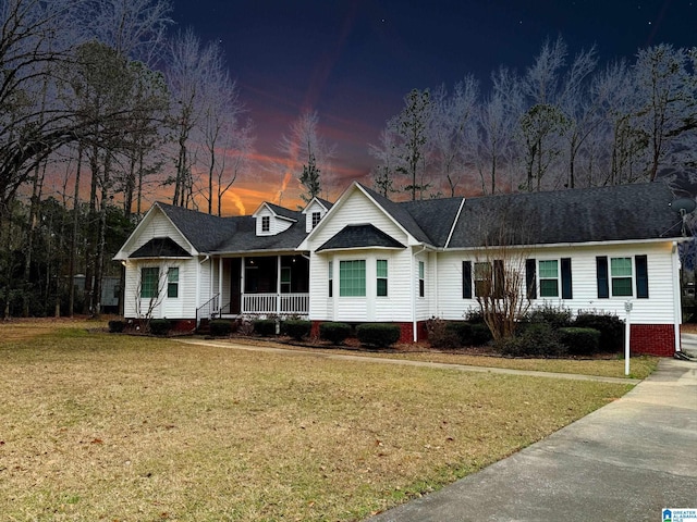 view of front facade with a porch and a front yard