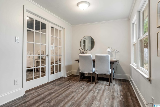 dining room featuring french doors, crown molding, baseboards, and wood finished floors