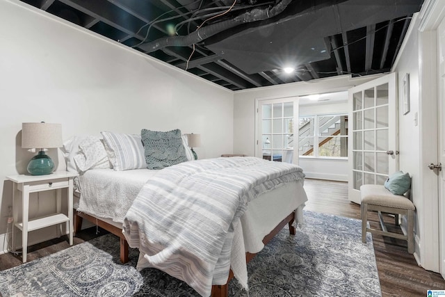 bedroom featuring wood finished floors