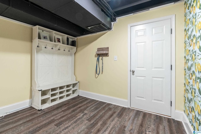 mudroom with wood finished floors and baseboards