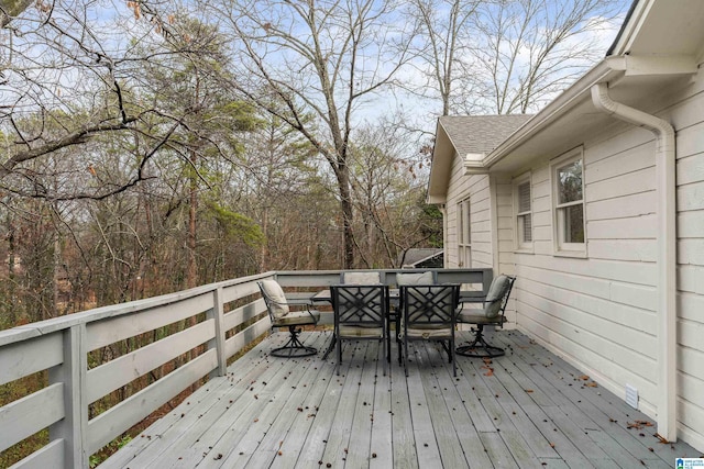 wooden deck with outdoor dining space