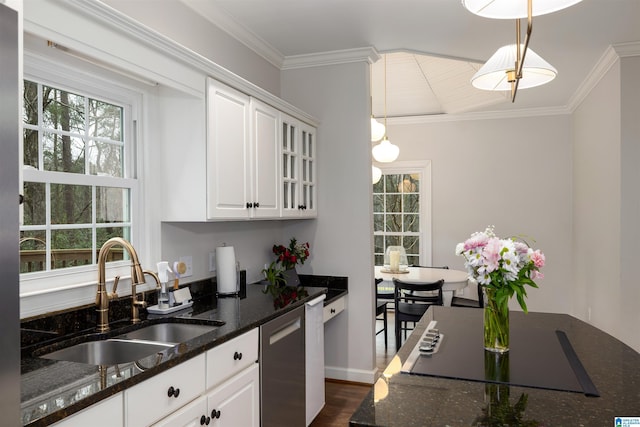 kitchen with dishwasher, dark stone countertops, decorative light fixtures, white cabinetry, and a sink