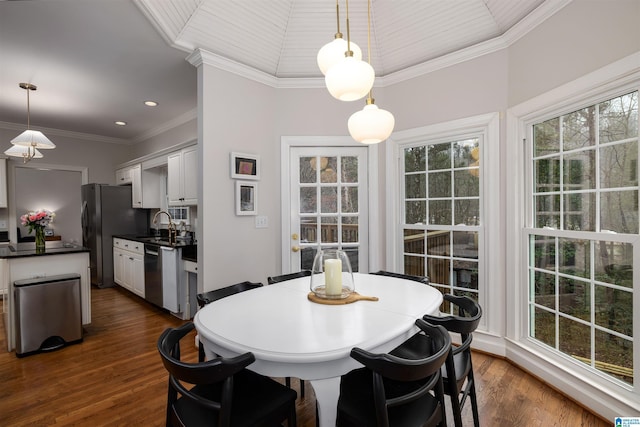 dining area featuring dark wood-type flooring, recessed lighting, and crown molding