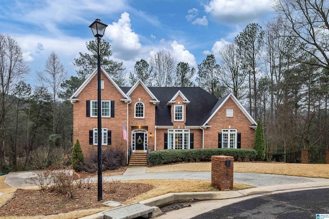 traditional-style home with brick siding