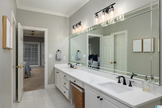 ensuite bathroom featuring ensuite bathroom, a sink, and crown molding