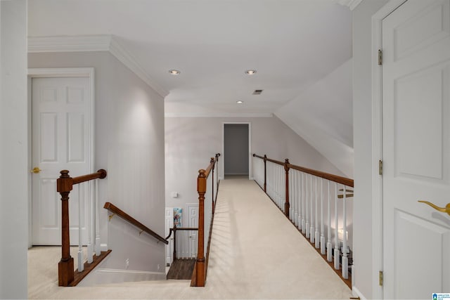 corridor with light carpet, visible vents, ornamental molding, an upstairs landing, and recessed lighting