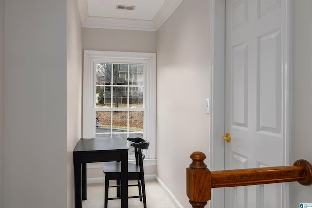 interior space with light carpet, ornamental molding, visible vents, and baseboards