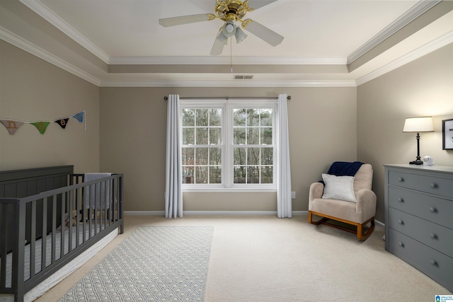 bedroom with light colored carpet, visible vents, baseboards, a nursery area, and crown molding