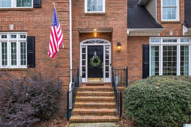 property entrance with brick siding