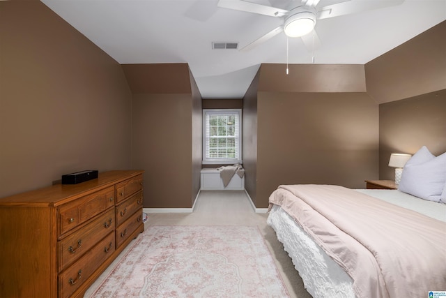 bedroom with baseboards, visible vents, ceiling fan, and light colored carpet