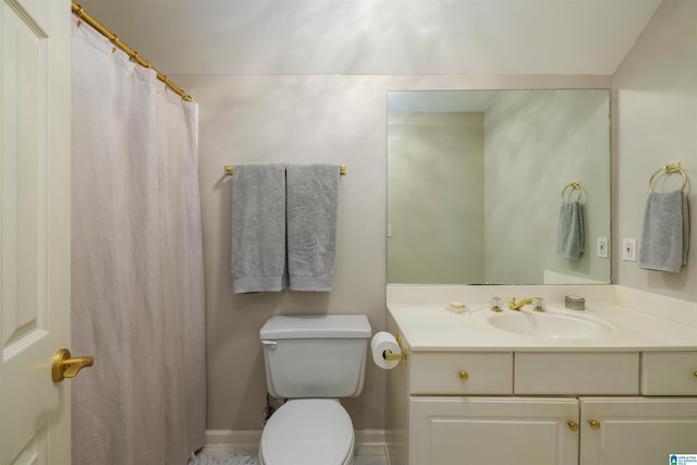 full bathroom with toilet, baseboards, and vanity