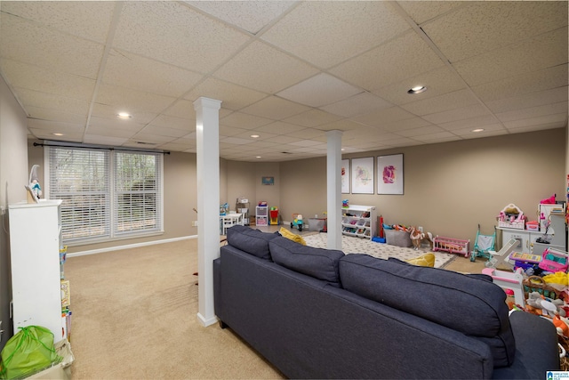 living area with recessed lighting, light colored carpet, a drop ceiling, and baseboards