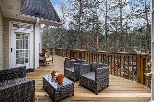 wooden terrace with outdoor lounge area