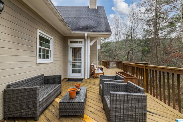 wooden terrace featuring an outdoor living space